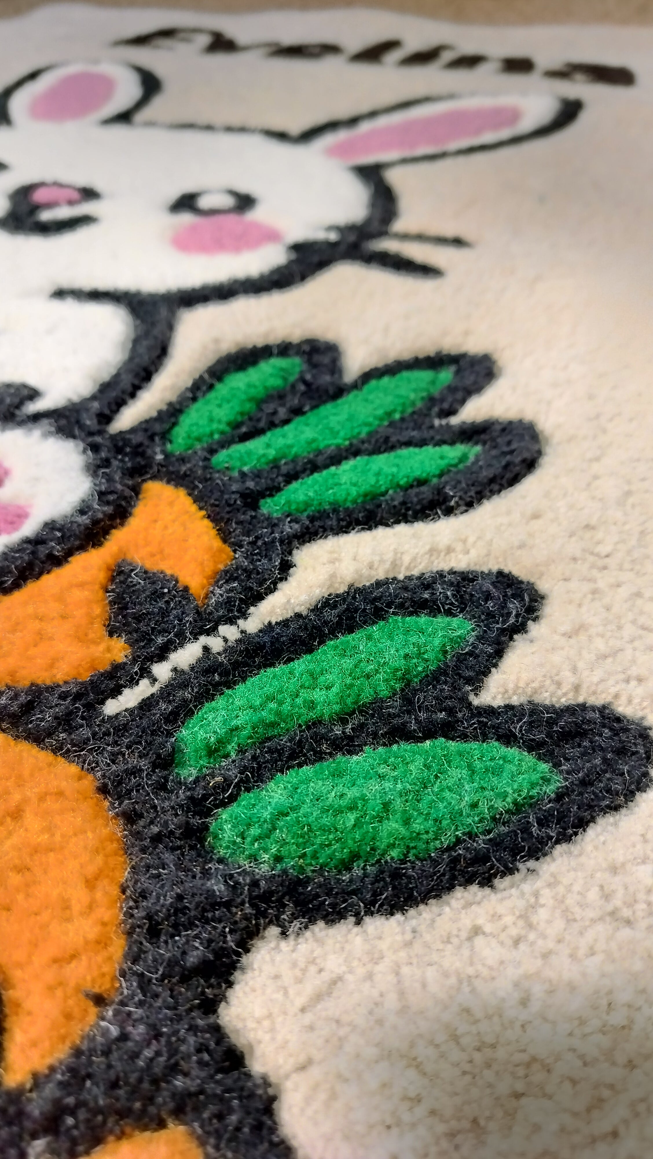 Close-up of handmade personalised wool rug with natural texture and hand-finished details