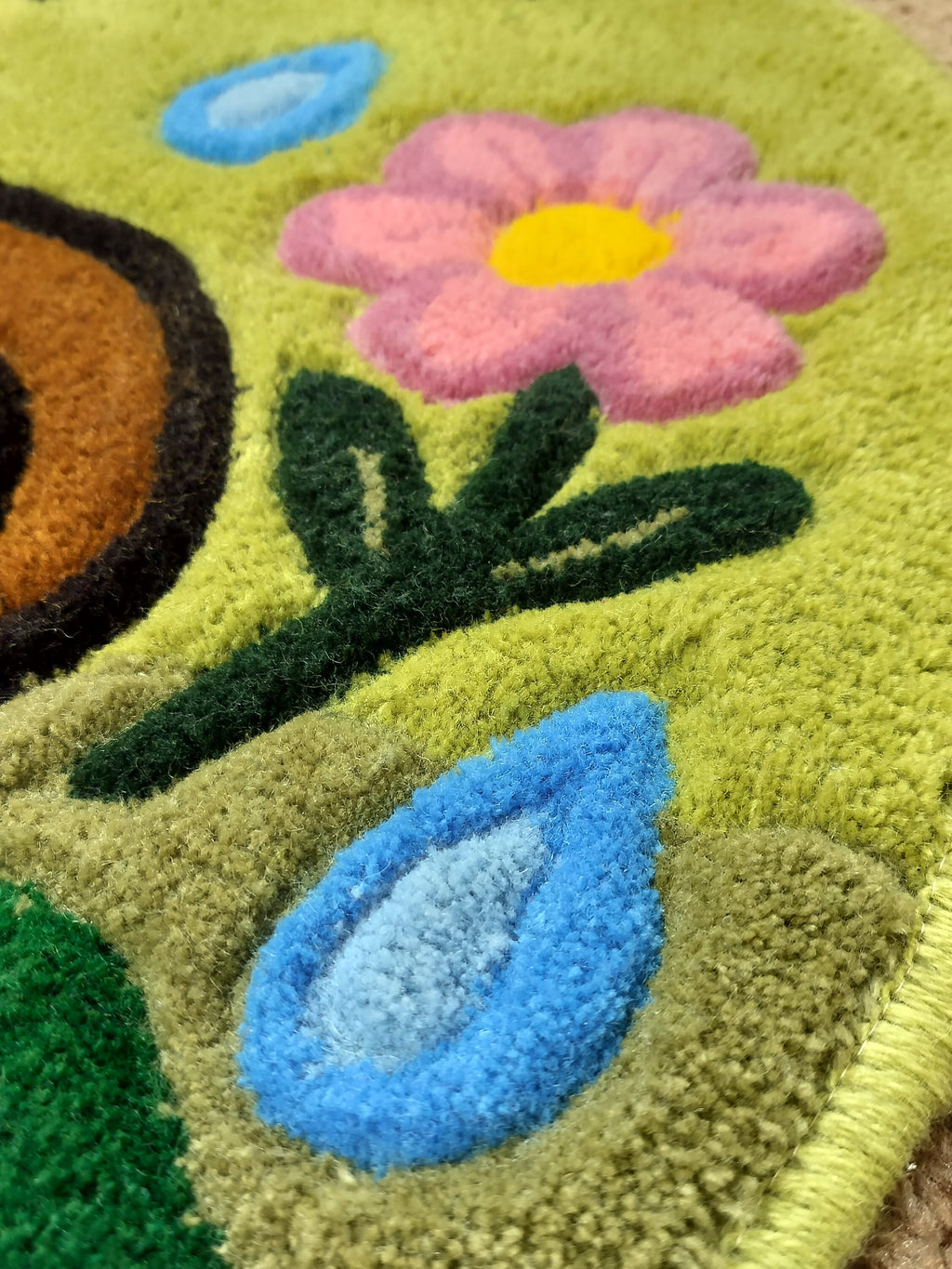 Close-up of handmade personalised wool rug with natural texture and hand-finished details