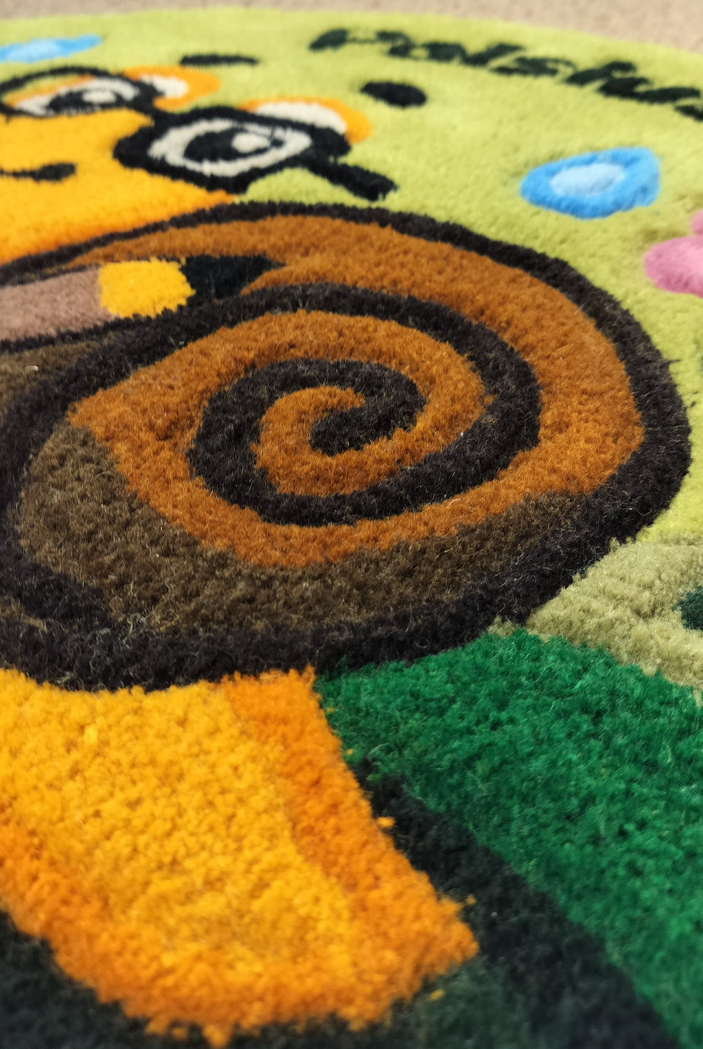 Close-up of handmade personalised wool rug with natural texture and hand-finished details