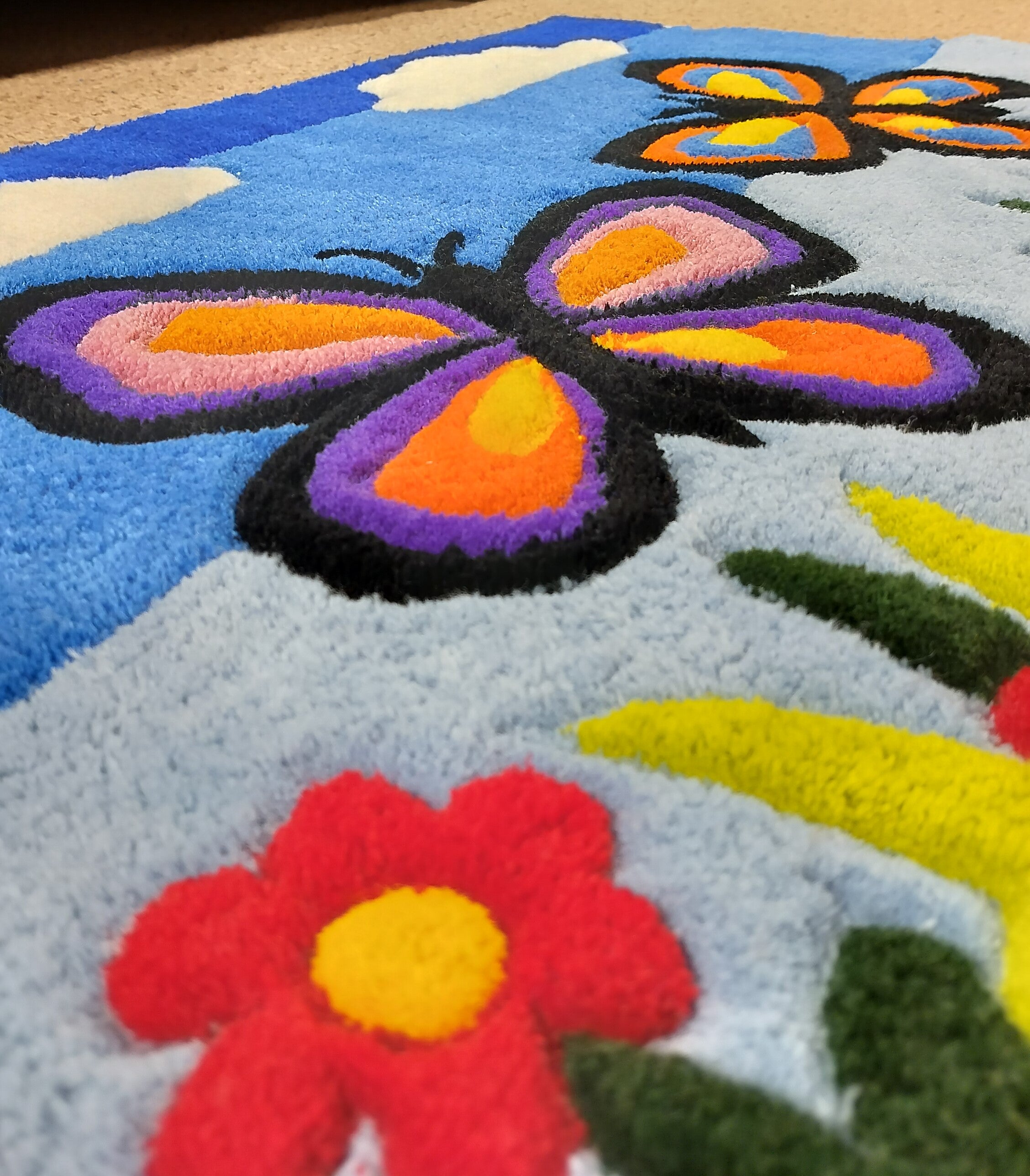 Close-up of handmade personalised wool rug with natural texture and hand-finished details