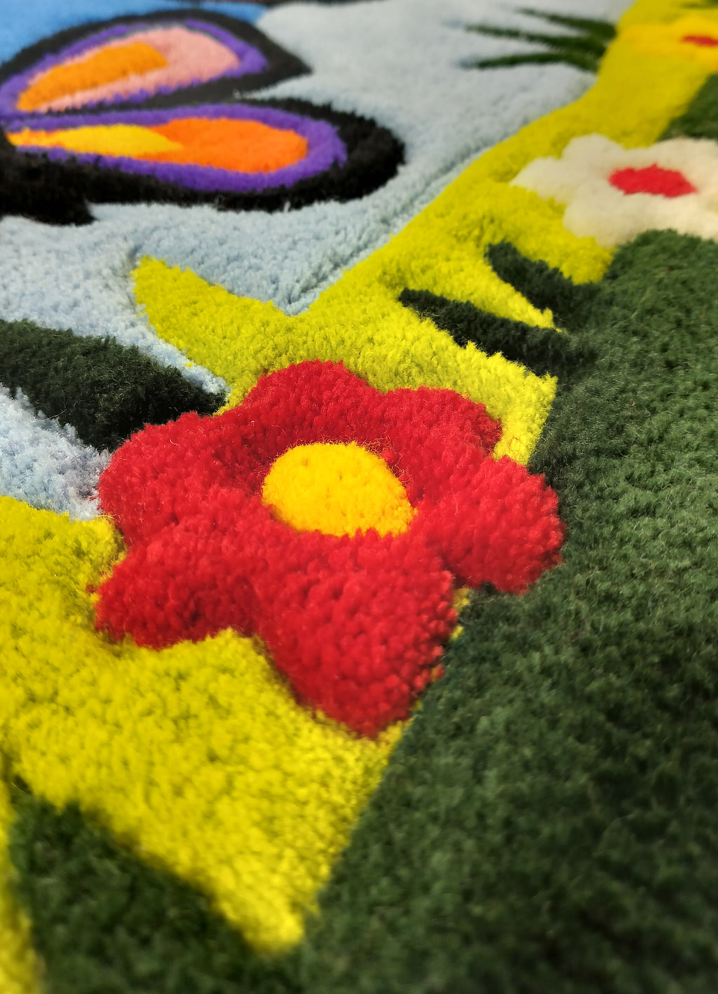 Close-up of handmade personalised wool rug with natural texture and hand-finished details