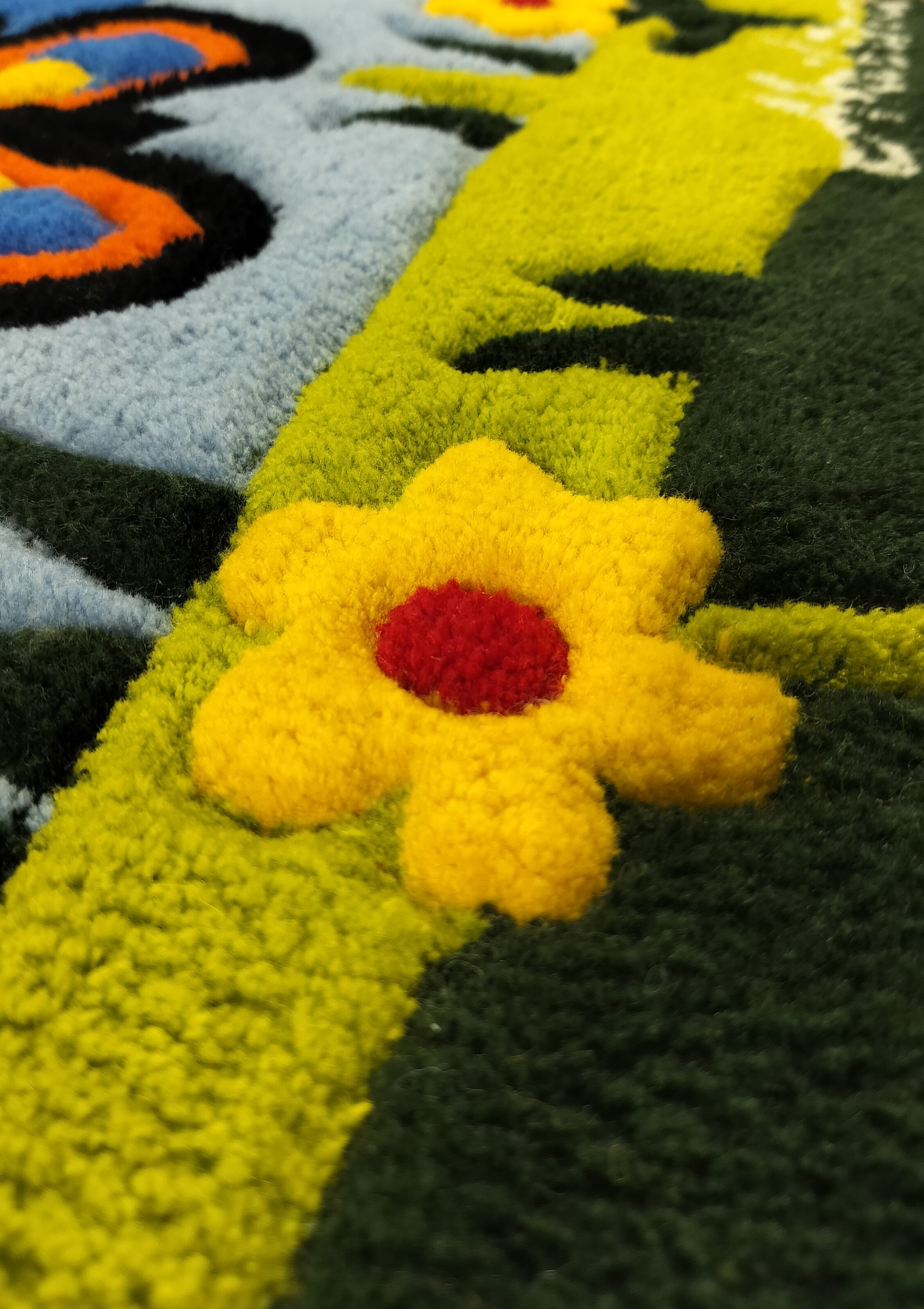Close-up of handmade personalised wool rug with natural texture and hand-finished details
