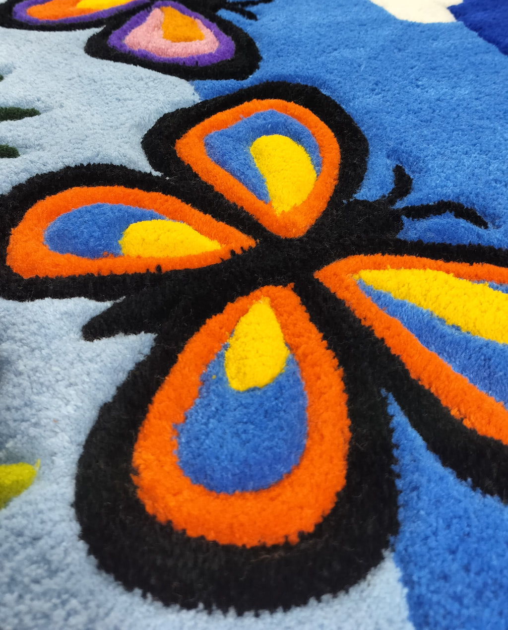 Close-up of handmade personalised wool rug with natural texture and hand-finished details