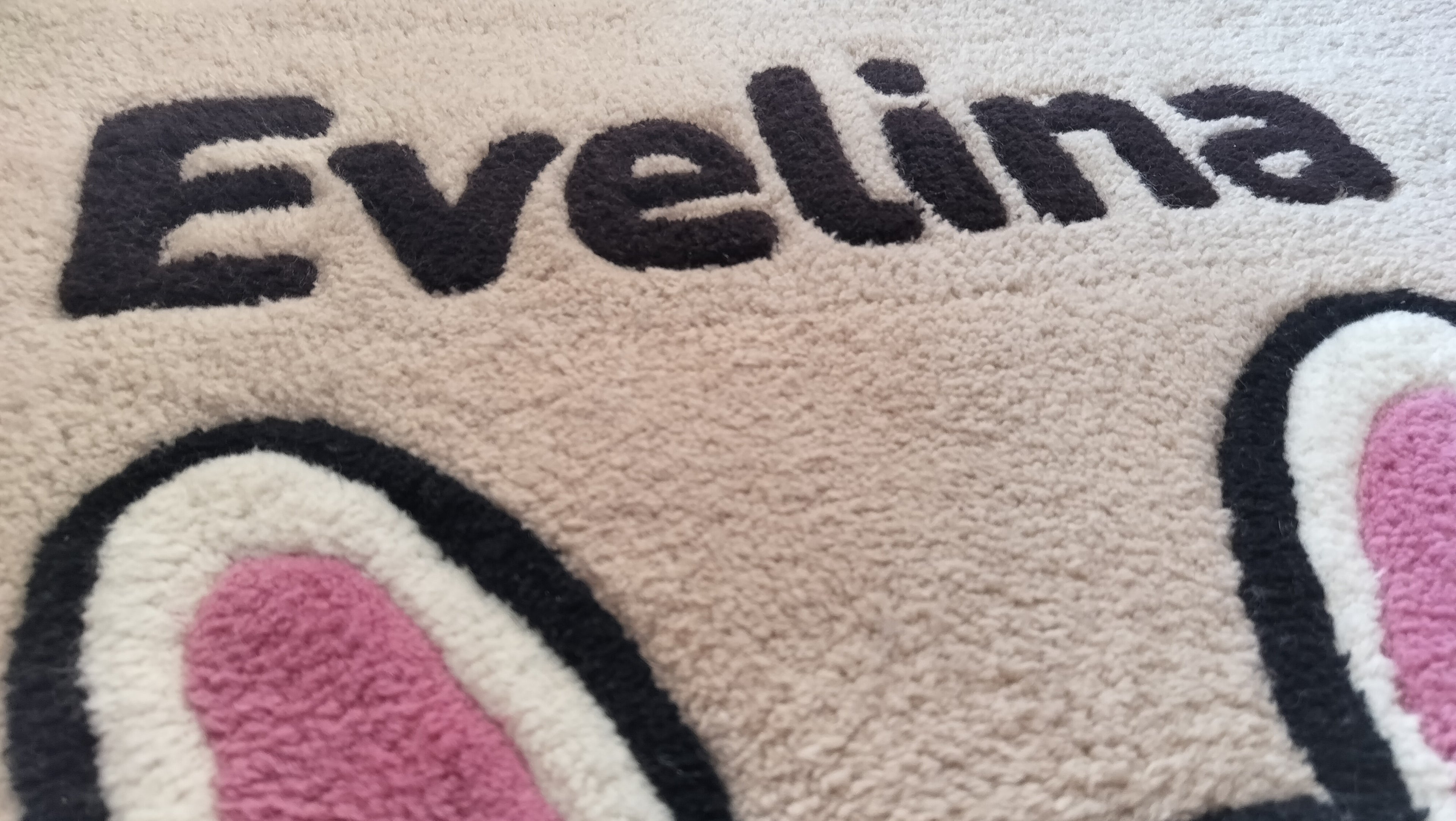 Close-up of handmade personalised wool rug with natural texture and hand-finished details