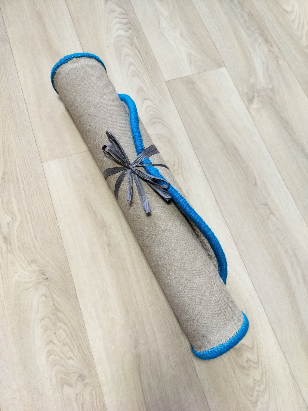 rolled bee wool rug handmade tufted carpet showing thickness and soft natural wool structure