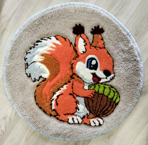 Personalized wool rug with squirrel design and initials, hand tufted from natural wool.